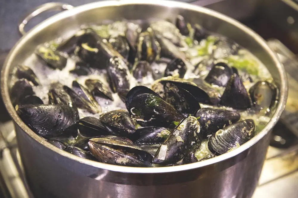 Chefs working over an open pass of the kind at the heart of The Clove Club