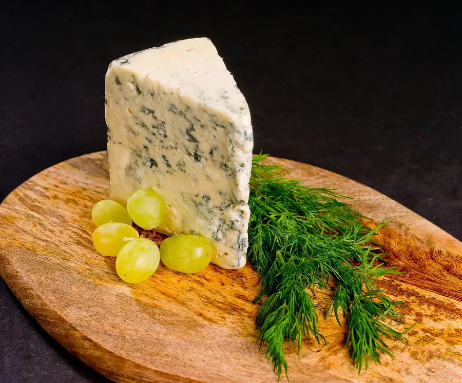 Selection of British farmhouse cheeses served on a wooden board