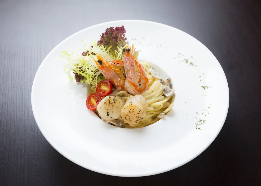Plated Scottish shellfish of the kind opening the surprise menu at The Kitchin