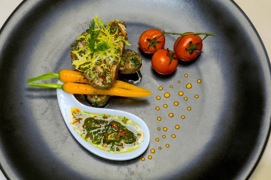 Precisely plated seasonal vegetable course in the style of Simon Rogan