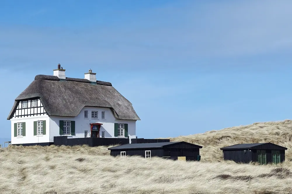 Weathered seaside pub on an English coast, in the spirit of The Sportsman at Seasalter