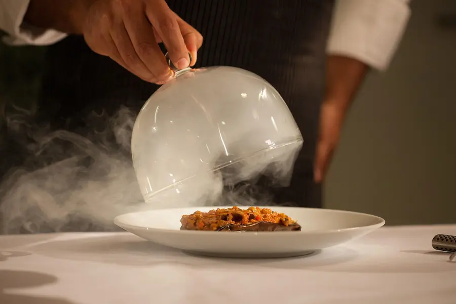 Chefs plating dishes in a Michelin-starred United Kingdom kitchen